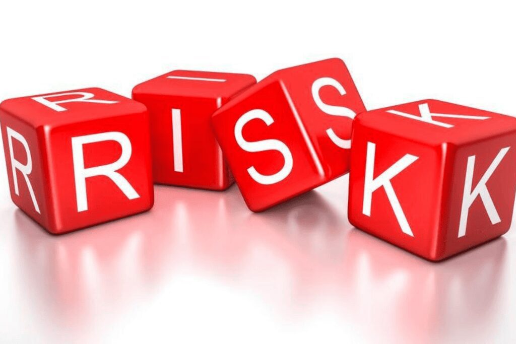 Red blocks spelling out the word 'RISK' on a white surface.