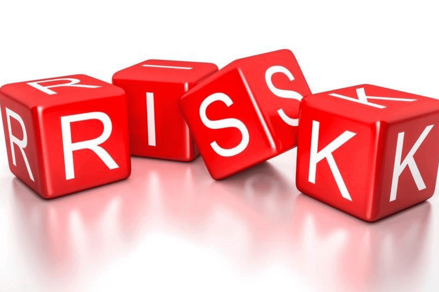 Red blocks spelling out the word 'RISK' on a white surface.